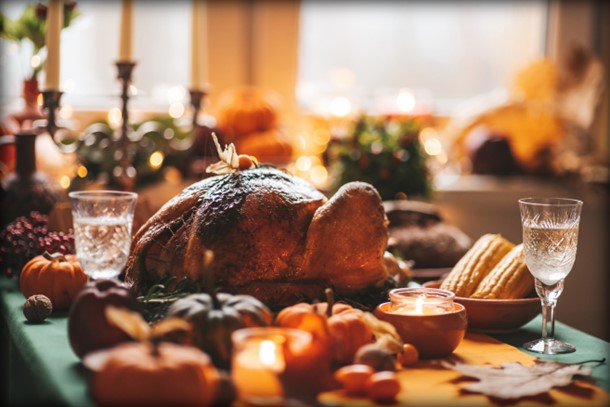 Photo of a Thanksgiving dinner set on a table.